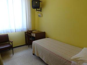 TV a/nebo společenská místnost v ubytování Hotel Saturno
