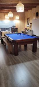 a pool table in the middle of a room at Chiloé,Curaco de Velez casa de veraneo in Curaco de Velez