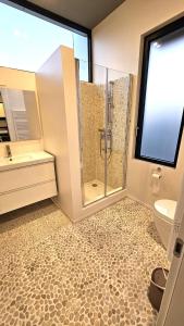 a bathroom with a shower and a toilet and a sink at Interno 8 in Padova