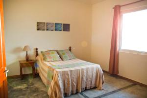 En eller flere senge i et værelse på Villa Fair Shares 1 + 16 billeder