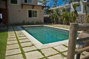 a swimming pool in the backyard of a house at Villa Fair Shares 1 in Poste Lafayette