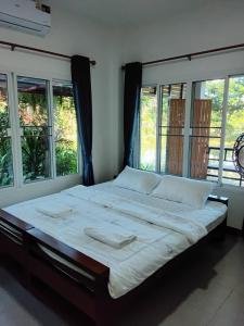Giường trong phòng chung tại Huan Janto Homestay - Karuna