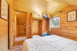 En eller flere senge i et værelse på Chalet la montagne numero 10