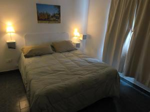 En eller flere senge i et værelse på Valle Encantado