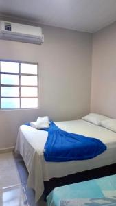 En eller flere senge i et værelse på Chácara Recanto da Paz