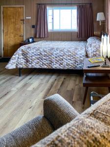 Ένα ή περισσότερα κρεβάτια σε δωμάτιο στο Scotty's Motel