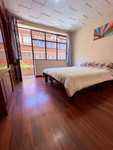 Postel nebo postele na pokoji v ubytování Aquisito Nomas Es