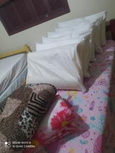 Postel nebo postele na pokoji v ubytování House in Balneário Atlântico half a block from the sea