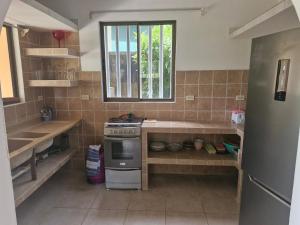a kitchen with a stove and a window at El Diamante - Playa Hermosa in Playa Hermosa +40 photos