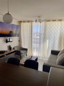 Et tv og/eller underholdning på Depto 2D 2B cercano a la playa