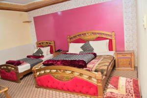 Postel nebo postele na pokoji v ubytování Hotel Ambassador + 10 fotografií