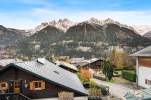 a view of a village with mountains in the background at Chalet Dents Blanches - Latitude Champéry in Champéry