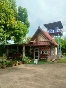 a small house with a sign in front of it at Rawinnipha's Resort & Garden Khonkaen in Khon Kaen