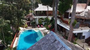 an overhead view of a swimming pool in front of a house at Hidden Paradise Private Villa 3, Langkawi in Teluk Datai