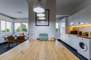a kitchen with a table and a dining room at Ambassador's Retreat in Oeiras