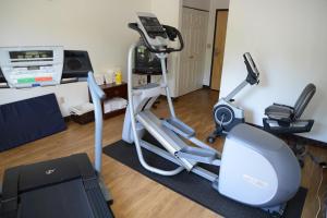 a living room with a gym with a treadmill at Riversage Billings Inn in Billings