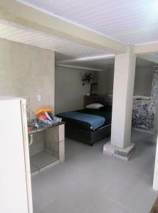 a bedroom with a bed in a room at Jade Beach Club in São Vicente