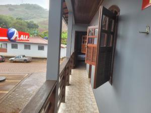 a room with a view of a gas station at Pousada Cachoeira in Itambé do Mato Dentro