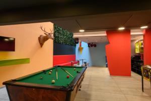 a billiard room with a pool table in the middle at Franz Apartments in Ilirska Bistrica +130 photos
