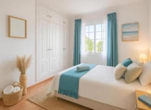 a bedroom with a large bed and a window at Loma Estrella Ocean Suite Upper Arguineguín in Arguineguín