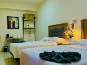 Cama o camas de una habitación en Hotel Grand Lion 14 fotos más