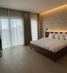 Postel nebo postele na pokoji v ubytování NK Hotel Lagrace