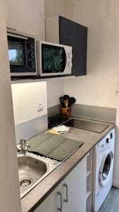 Kuchyň nebo kuchyňský kout v ubytování Escale Océane T1 calme 5 min à pied de la mer