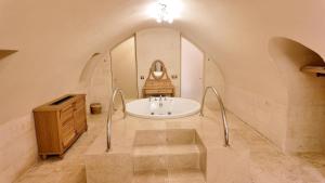 a bathroom with a sink and a bath tub at Shamas Hotel in Midyat +90 photos