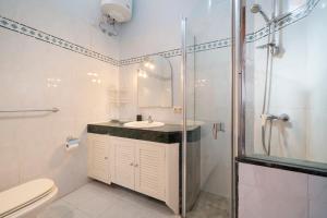a bathroom with a shower and a sink and a toilet at Lanzahost Casa Campagnolo in Playa Honda +10 photos
