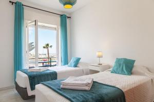 Postel nebo postele na pokoji v ubytování B77 - Im on Avenida Apartment in Lagos