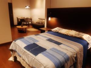 En eller flere senge i et værelse på Garzonier más Piscina