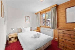 Ένα ή περισσότερα κρεβάτια σε δωμάτιο στο Wohnung in Gstaad