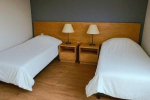 Giường trong phòng chung tại Panorama Aparts Chalten