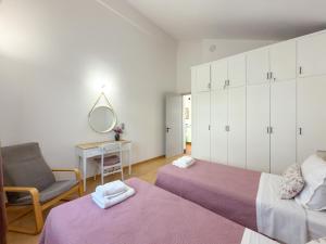 En eller flere senge i et værelse på Villa Kalami Look Out