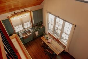an overhead view of a kitchen with a table and two windows at Luxury farm Stay, Alexandria in Glen Robertson