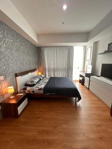 Giường trong phòng chung tại Fairview House apartment karawaci +41 ảnh