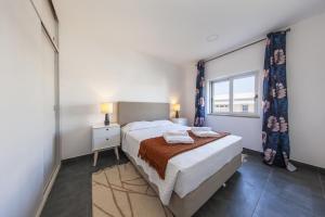 En eller flere senge i et værelse på B74 - Baluarte Holiday Flat in Lagos