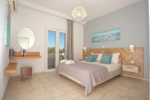 Postel nebo postele na pokoji v ubytování Notos Villas