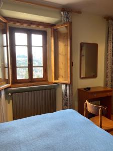 En eller flere senge i et værelse på B B Regina