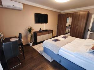 Postel nebo postele na pokoji v ubytování Katica Apartman