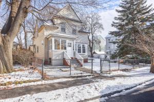 a house with a fence in the snow at Fairmont Rooms in Worcester
