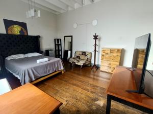 Ένα ή περισσότερα κρεβάτια σε δωμάτιο στο Casona Turística Gonzales