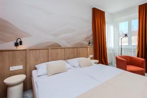 Postel nebo postele na pokoji v ubytování Le Petit