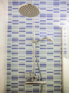 a lamp in a bathroom next to a window at B34 - Central Townhouse in Lagos in Lagos