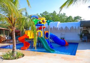 a water park with a playground with a slide at Casa Luna Laguna Beach in Tolú