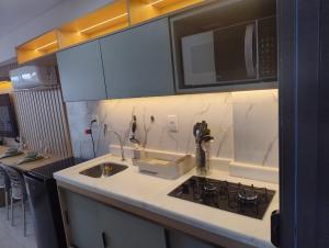 Køkken eller tekøkken på Apart Makani Beach Flat Campas