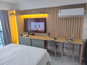 Et tv og/eller underholdning på Apart Makani Beach Flat Campas