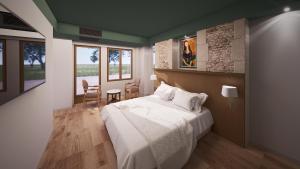 Postel nebo postele na pokoji v ubytování Domaine de Bayeux