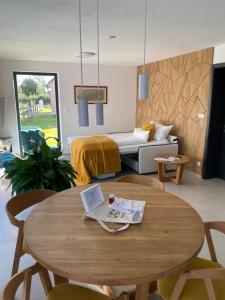 a living room with a table and a couch at Nad Soutokem in Volary