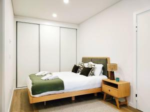 En eller flere senge i et værelse på By the Sea